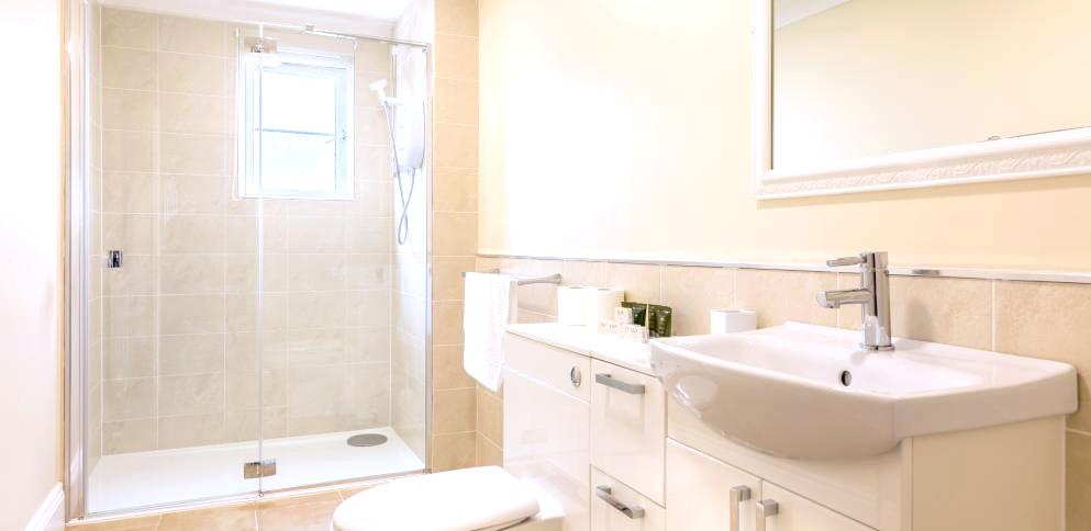 bathroom with large shower and white sanitaryware